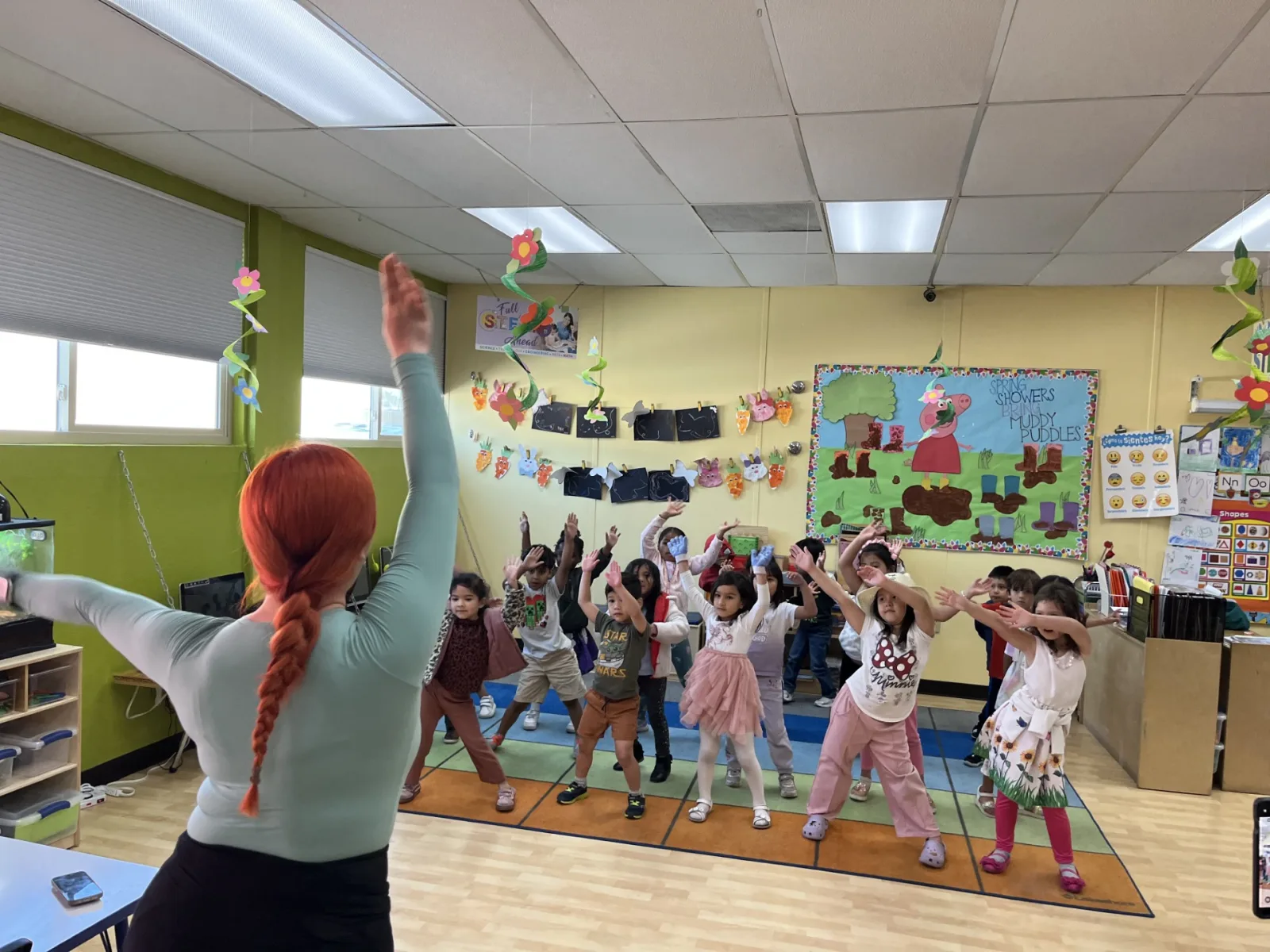Children expressing themselves through energetic movement and creative play in Kids Adventure Learning Center's dance and fitness enrichment program