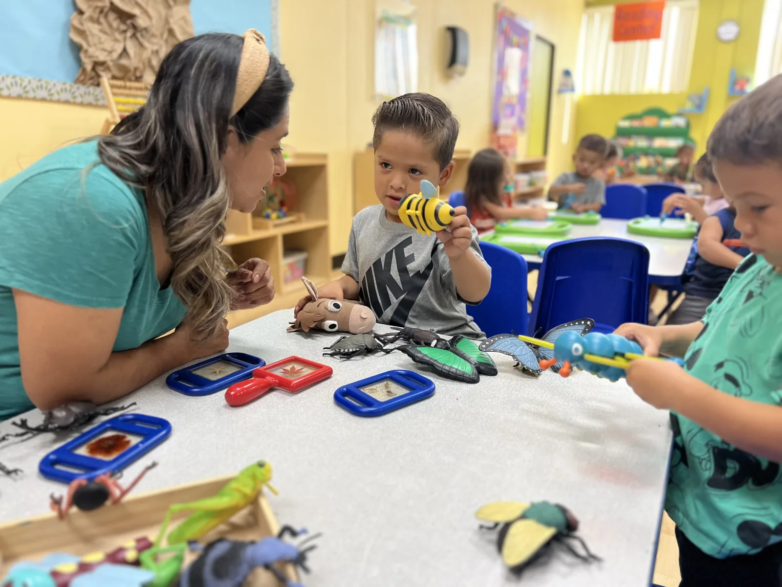 Experienced educators nurturing and caring for young children during critical early brain development years at Kids Adventure Learning Center