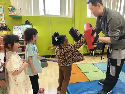 Children practicing Tae Kwon Do at Kids Adventure Learning Center building discipline, confidence, and self-esteem