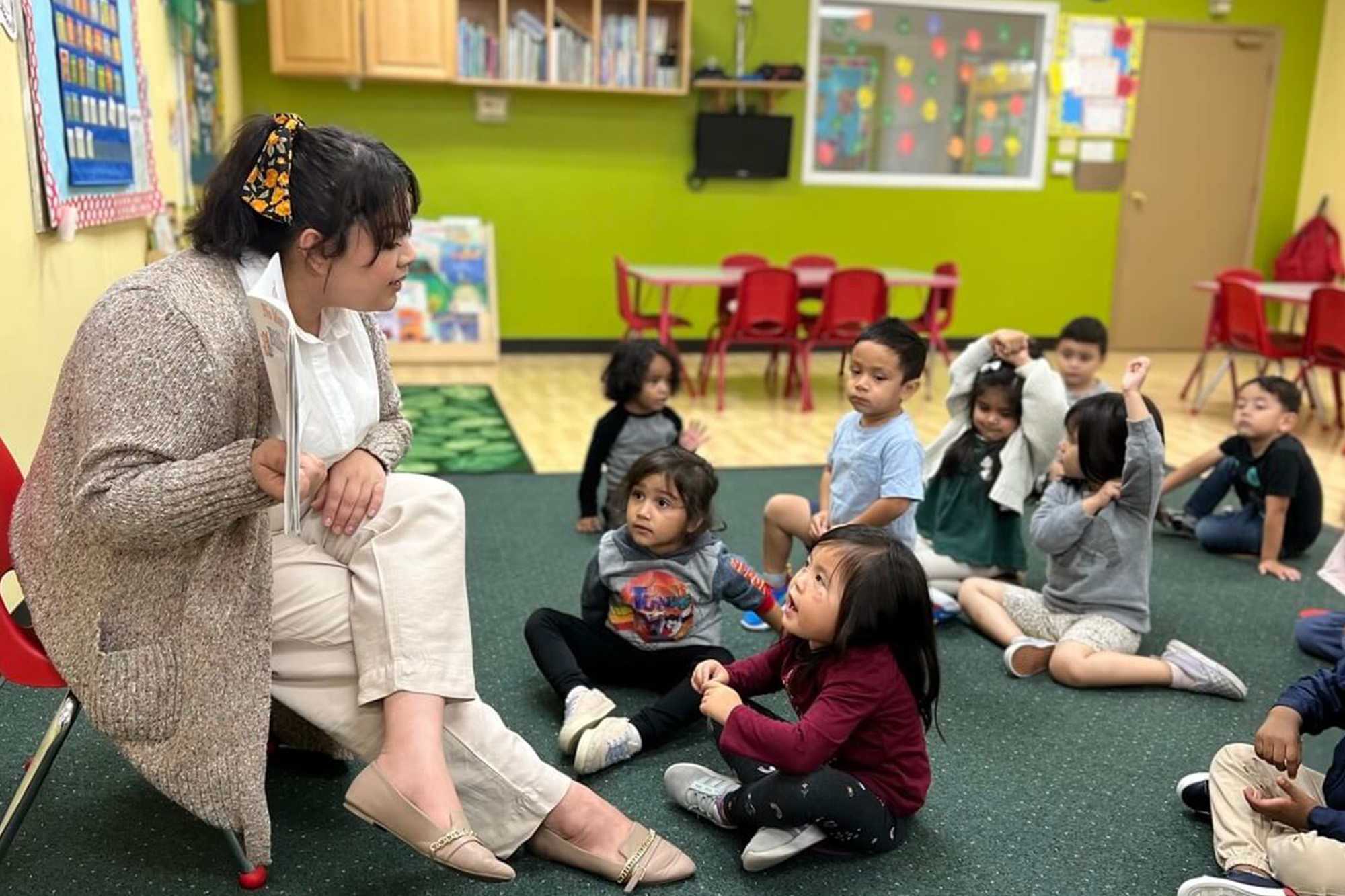 Buena Park-Private Kindergarten class engaged in a structured learning activity with attentive teachers